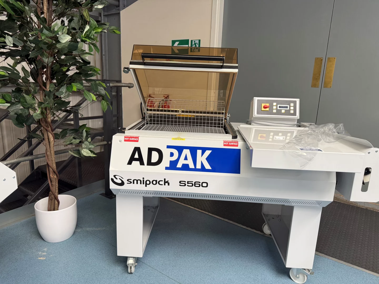 Adpak Manual Chamber Shrink Wrap Machine for packaging applications.